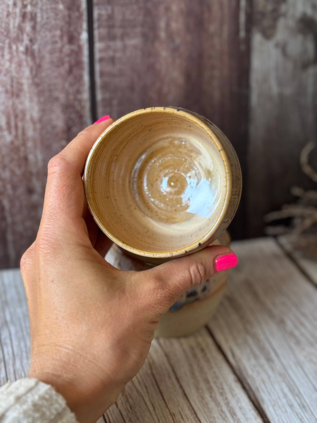 Mini hug mug in soft orange with brown spots