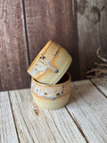 Mini hug mug in soft orange with brown spots