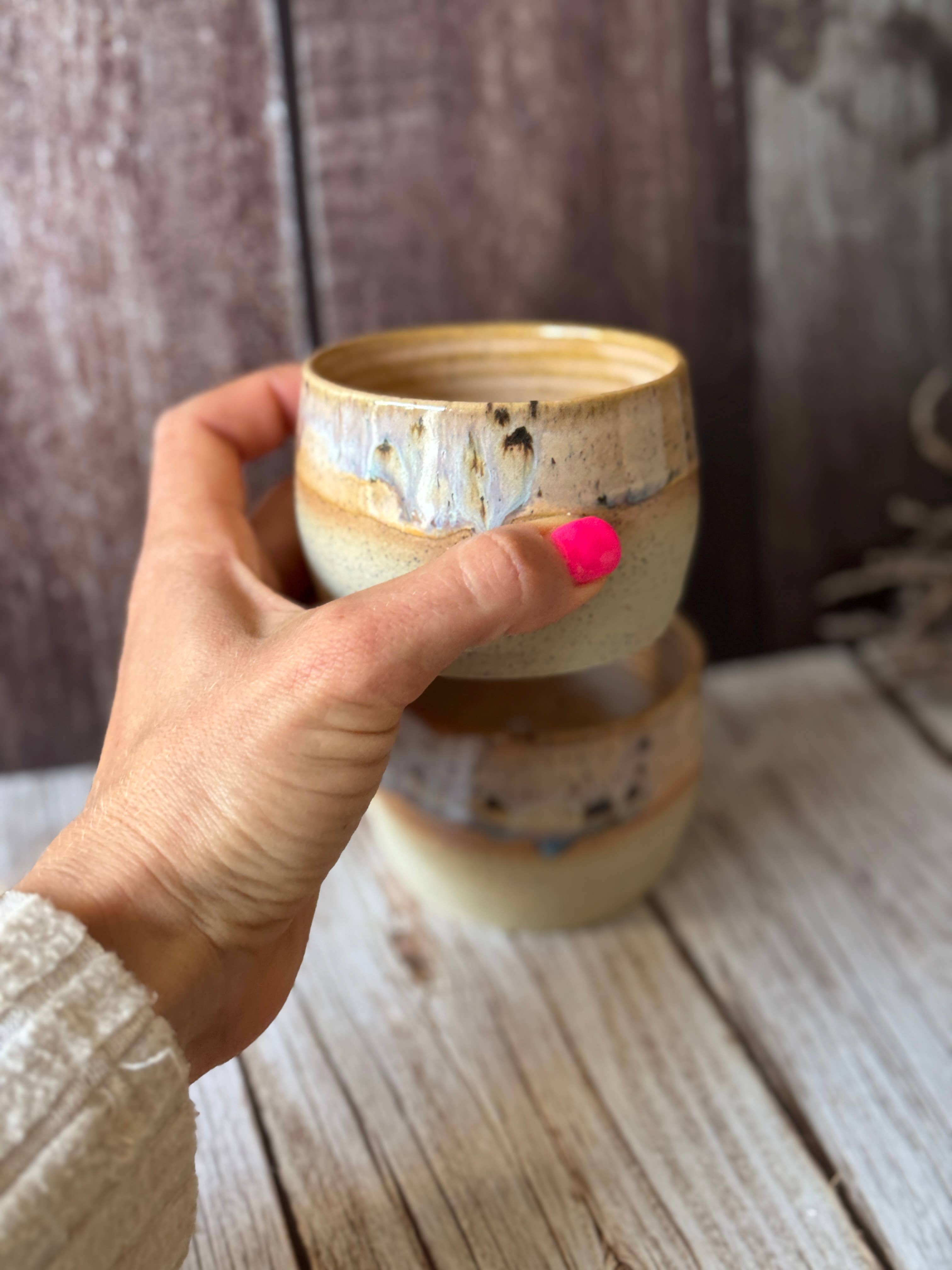 Mini hug mug in soft orange with brown spots