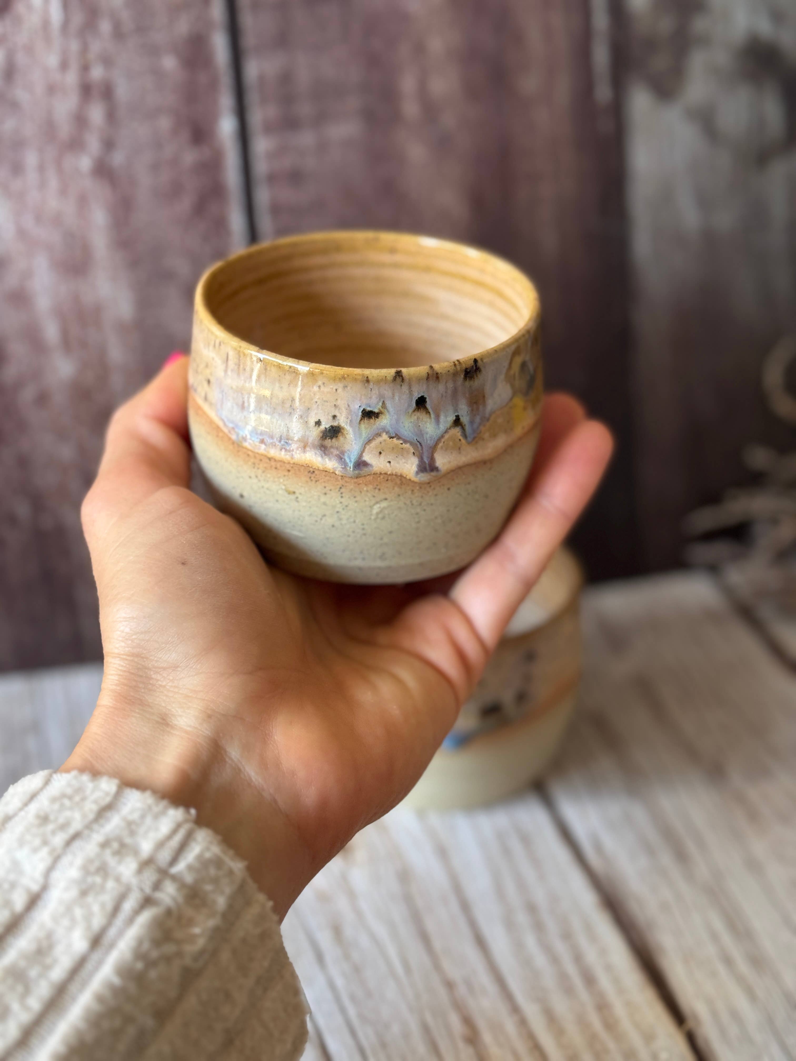 Mini hug mug in soft orange with brown spots